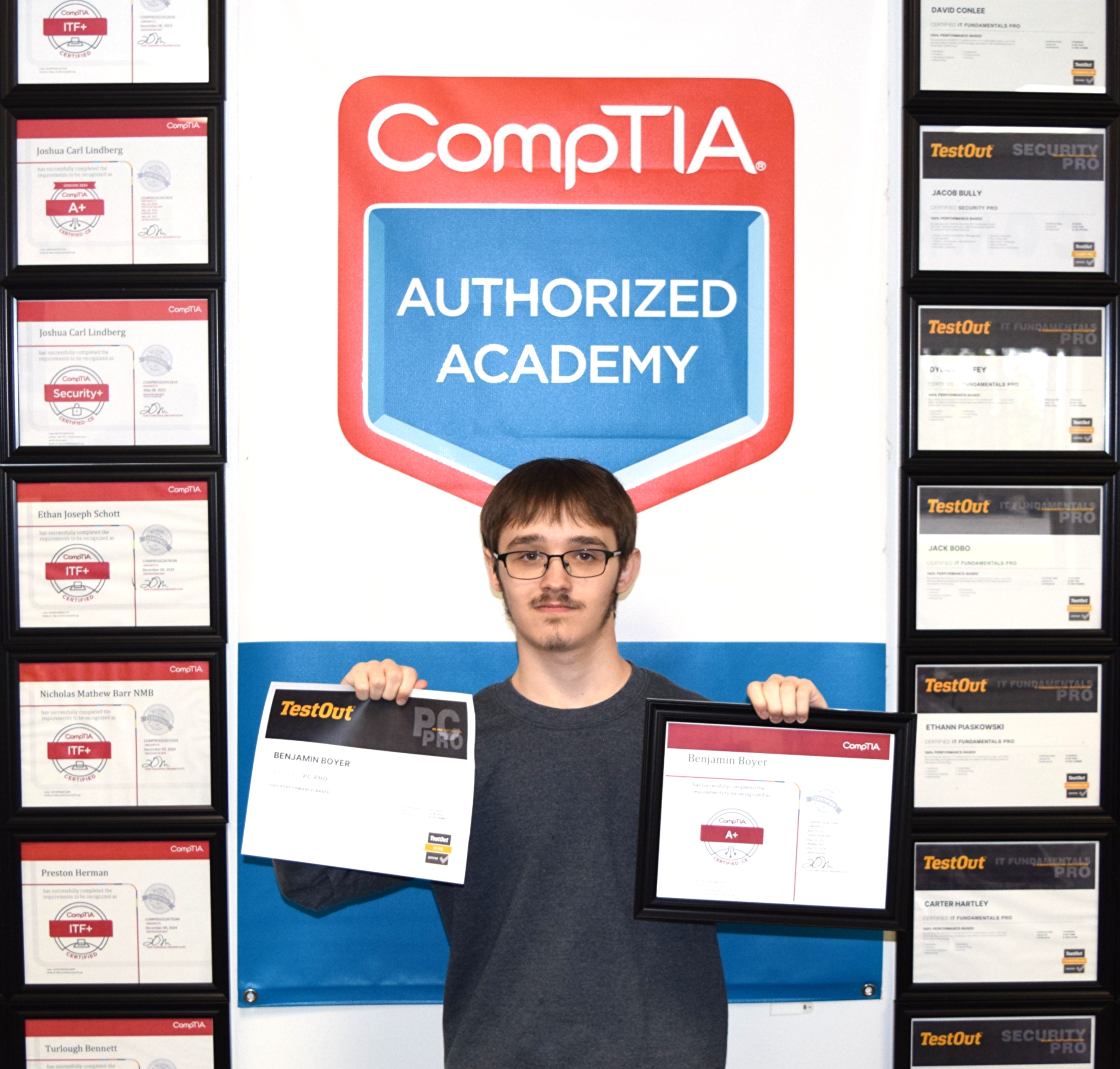 Cros-Lex student holding earned certifications